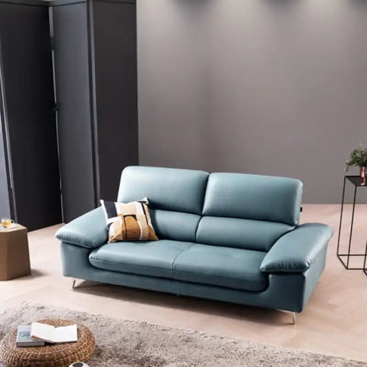 modern sofa with soft curved arms, supportive back cushions and raised chrome finish legs — angled view showing the full s...