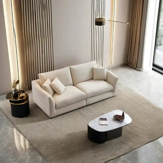 wide l shape fabric sofa with rounded arms, loose back cushions and deep comfortable seating — angled view showing the ful...
