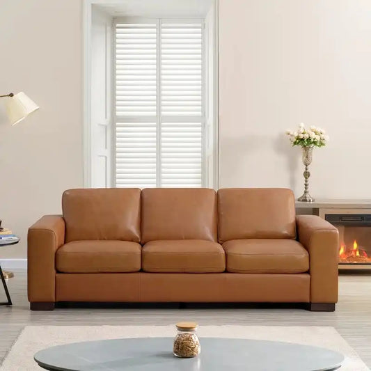 easy clean faux leather sofa with wide straight arms and thick supportive cushions — angled view showing the full shape an...