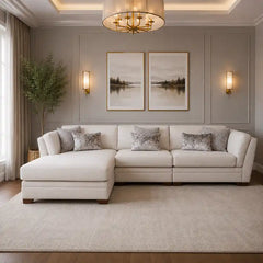 beige corner sofa with a compact l shape, soft cushions and a smooth fabric finish — angled view showing the full shape an...