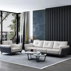 dual tone beige and charcoal fabric sofa with a soft cushioned back and deep seating — angled view showing the full shape...