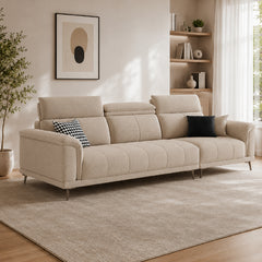beige l shape sofa with adjustable head support, rounded arms and slim raised legs — front view in a bright living room