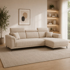 beige l shape sofa with adjustable head support, rounded arms and slim raised legs — side angle showing the arms and raise...