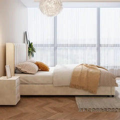 Elegant bed and cot modern bed design with slim legs and padded beige upholstery