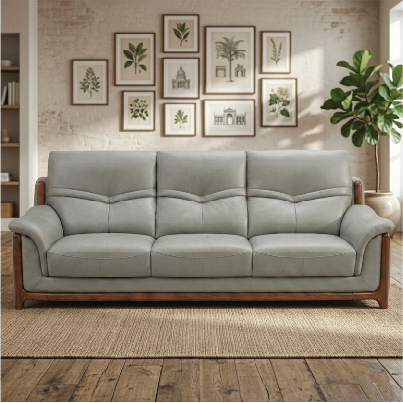 corner sofa with deep cushions, rounded arms and warm polished wooden side details — side angle showing the arms and raise...