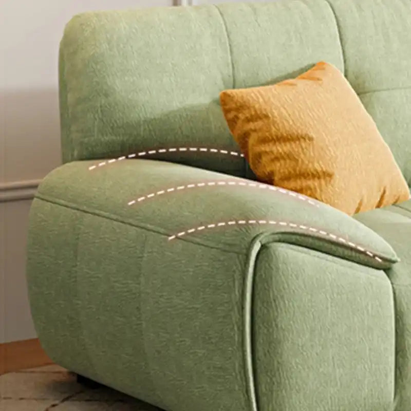 modern fabric sofa with clean square cushion details, soft arms and a simple balanced shape — wide room view showing the c...