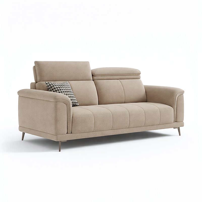 beige l shape sofa with adjustable head support, rounded arms and slim raised legs — close view showing the cushion and su...
