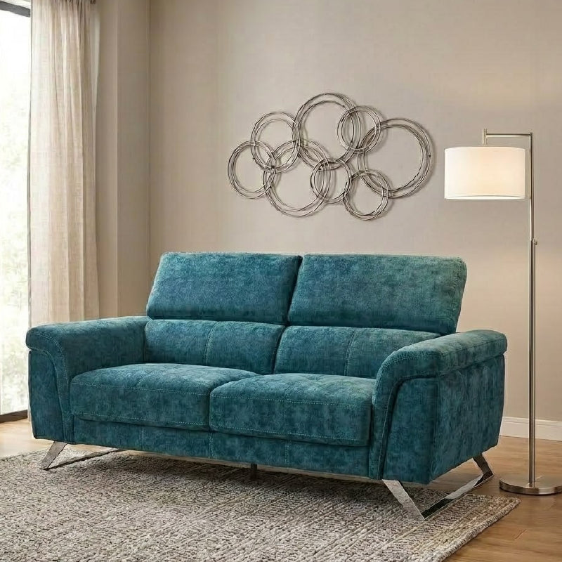 white l shape sofa with wide padded arms, supportive cushions and angled chrome finish legs — close view showing the cushi...