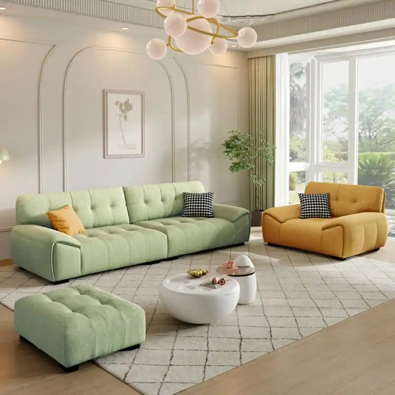 modern fabric sofa with clean square cushion details, soft arms and a simple balanced shape — angled view showing the full...