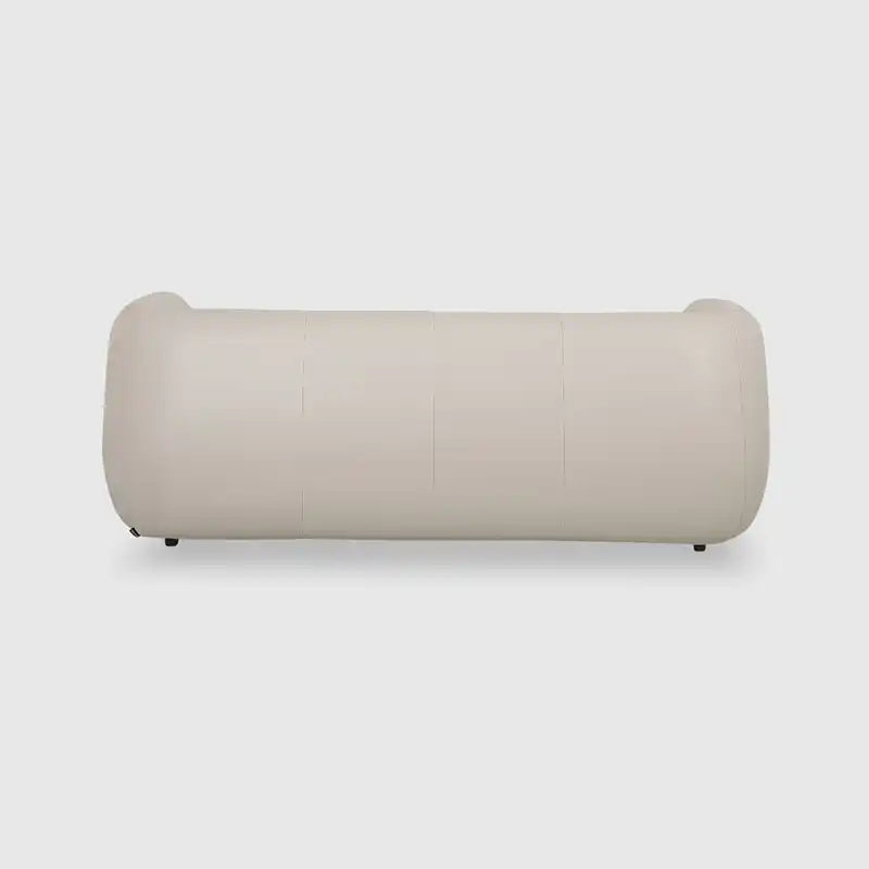 warm mustard rounded sofa with deep square cushioning and a soft textured finish — wide room view showing the complete sea...