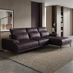 modern l shape sofa with high back cushions, slim metal legs and deep comfortable seating — wide room view showing the com...