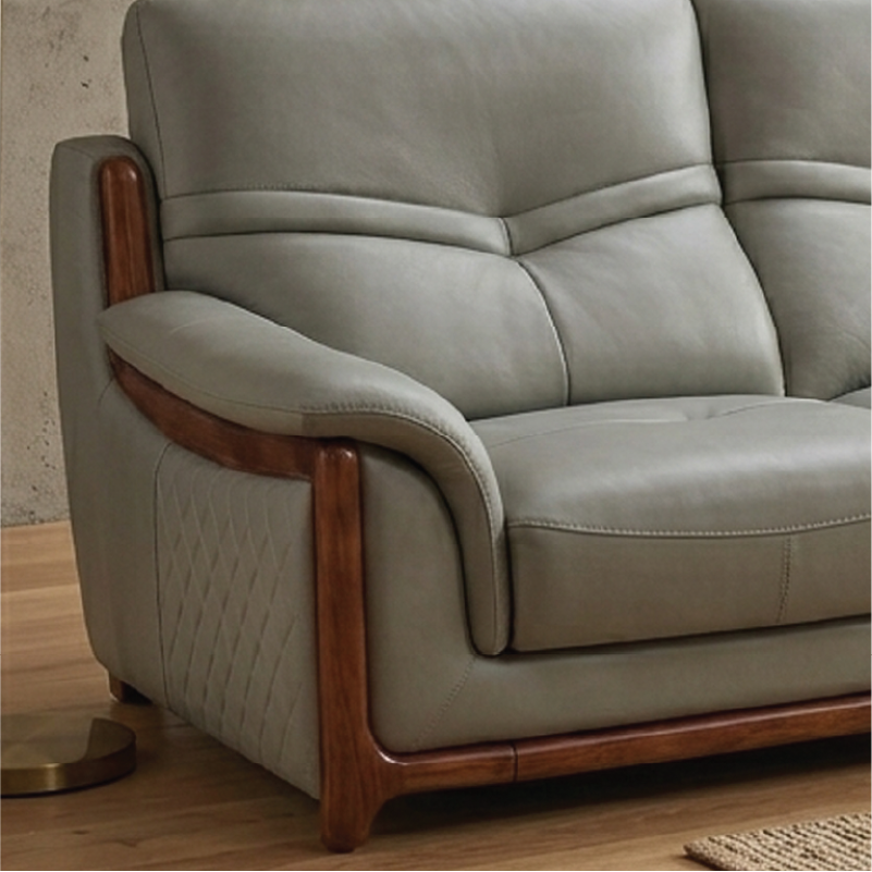 corner sofa with deep cushions, rounded arms and warm polished wooden side details — wide room view showing the complete s...