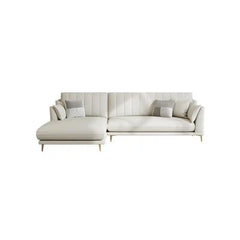 soft cream corner sofa with deep cushions, vertical back details and slim gold finish legs — front angle showing the back...