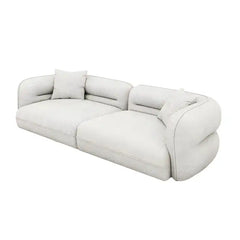 low lounge sofa with thick cushions, loose back pillows and soft rounded edges — front angle showing the back support and...