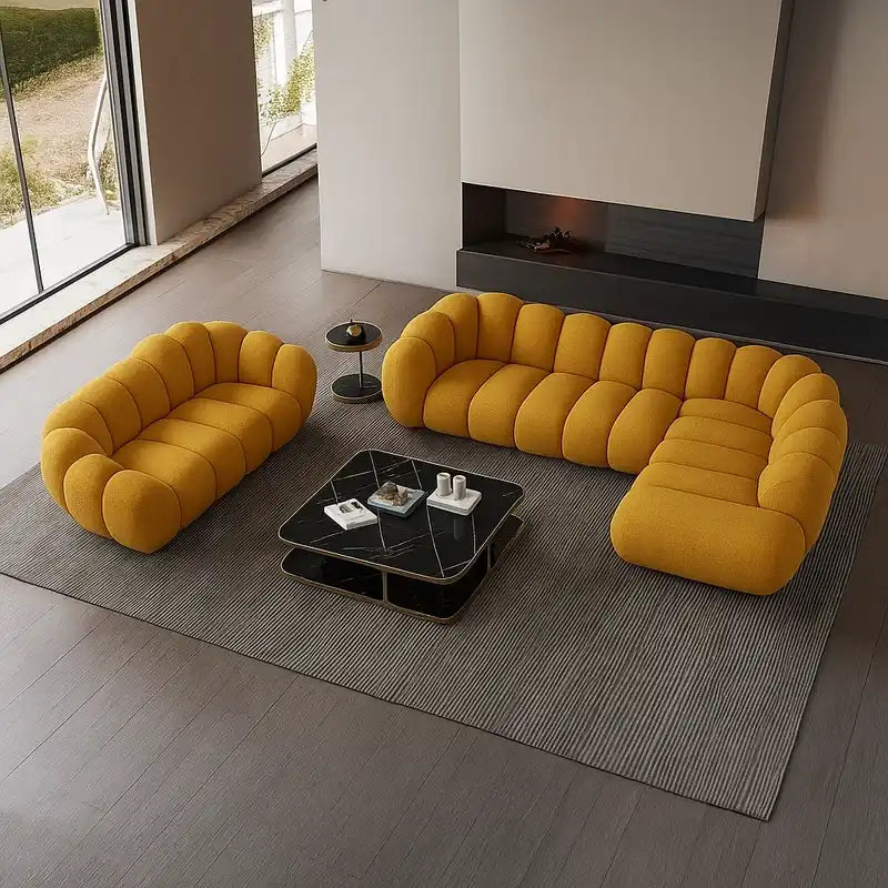 soft curved sofa with rounded cushion sections, a cloud like shape and a low relaxed base — alternate angle showing the fu...