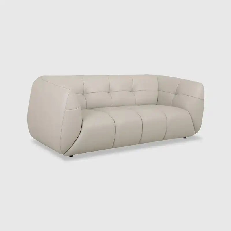 warm mustard rounded sofa with deep square cushioning and a soft textured finish — alternate angle showing the full depth...