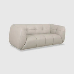 warm mustard rounded sofa with deep square cushioning and a soft textured finish — alternate angle showing the full depth...