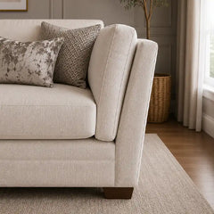 beige corner sofa with a compact l shape, soft cushions and a smooth fabric finish — alternate angle showing the full dept...