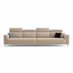 beige l shape sofa with adjustable head support, rounded arms and slim raised legs — close view showing the colour and mat...