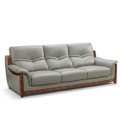 corner sofa with deep cushions, rounded arms and warm polished wooden side details — alternate angle showing the full dept...