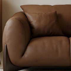 warm brown sofa with deep cushions, soft back support and wide comfortable arms — alternate angle showing the full depth a...