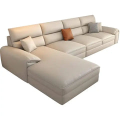 beige l shape leatherette sofa with deep seating, high back cushions and wide padded arms — full view with the complete sh...