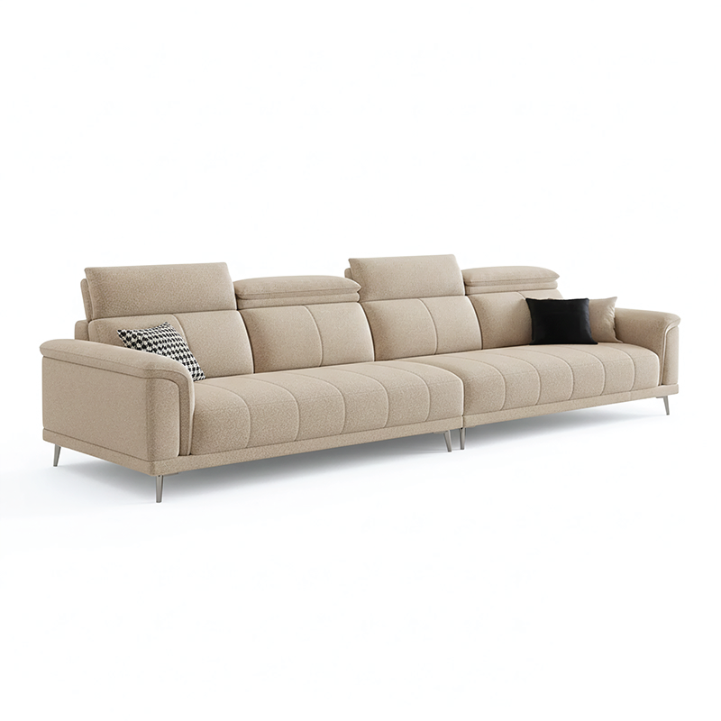 beige l shape sofa with adjustable head support, rounded arms and slim raised legs — full view with the complete shape cle...