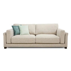 modern neutral fabric sofa with wide padded arms, thick cushions and clean straight lines — full view with the complete sh...