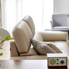 modern sofa with soft curved arms, supportive back cushions and raised chrome finish legs — full view with the complete sh...