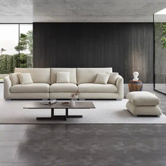 wide l shape fabric sofa with rounded arms, loose back cushions and deep comfortable seating — alternate angle showing the...