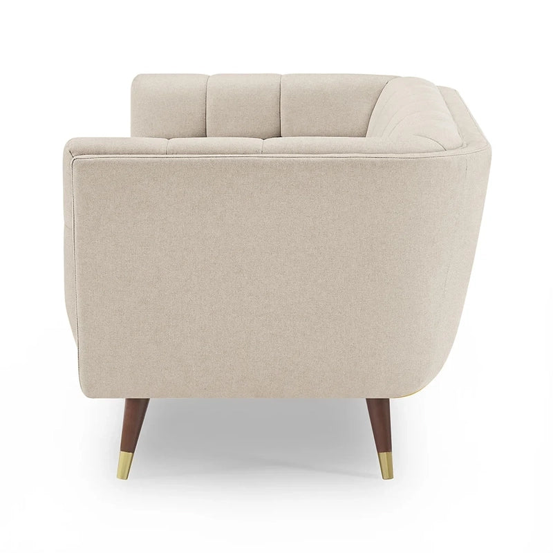beige fabric sofa with soft curved arms, square cushion details and raised wooden legs — full view with the complete shape...