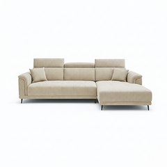 beige l shape sofa with adjustable head support, rounded arms and slim raised legs — front view in a bright living room
