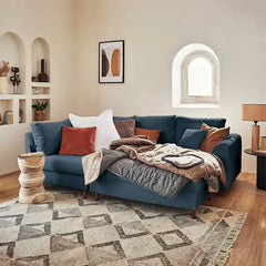 Sleeper sofa with a movable footstool, with easy conversion from seating to sleeping