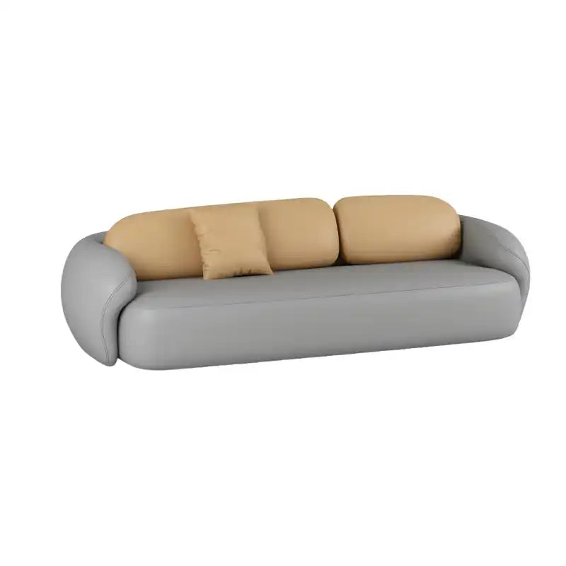 soft curved fabric sofa with cloud like cushions, wraparound arms and a low grounded base — close view showing the colour...